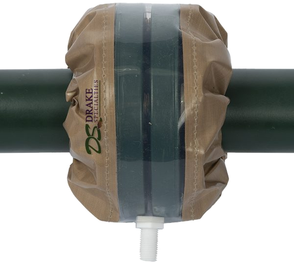 Clear PTFE flange spray shield with FEP window and drain nipple, fitted over a flanged joint