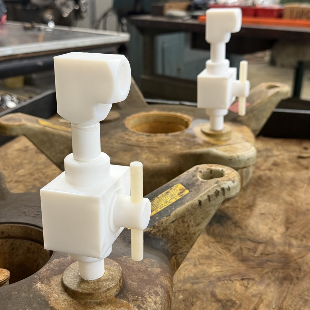 Filter lid vents modified to accept a solid PTFE valve and fittings