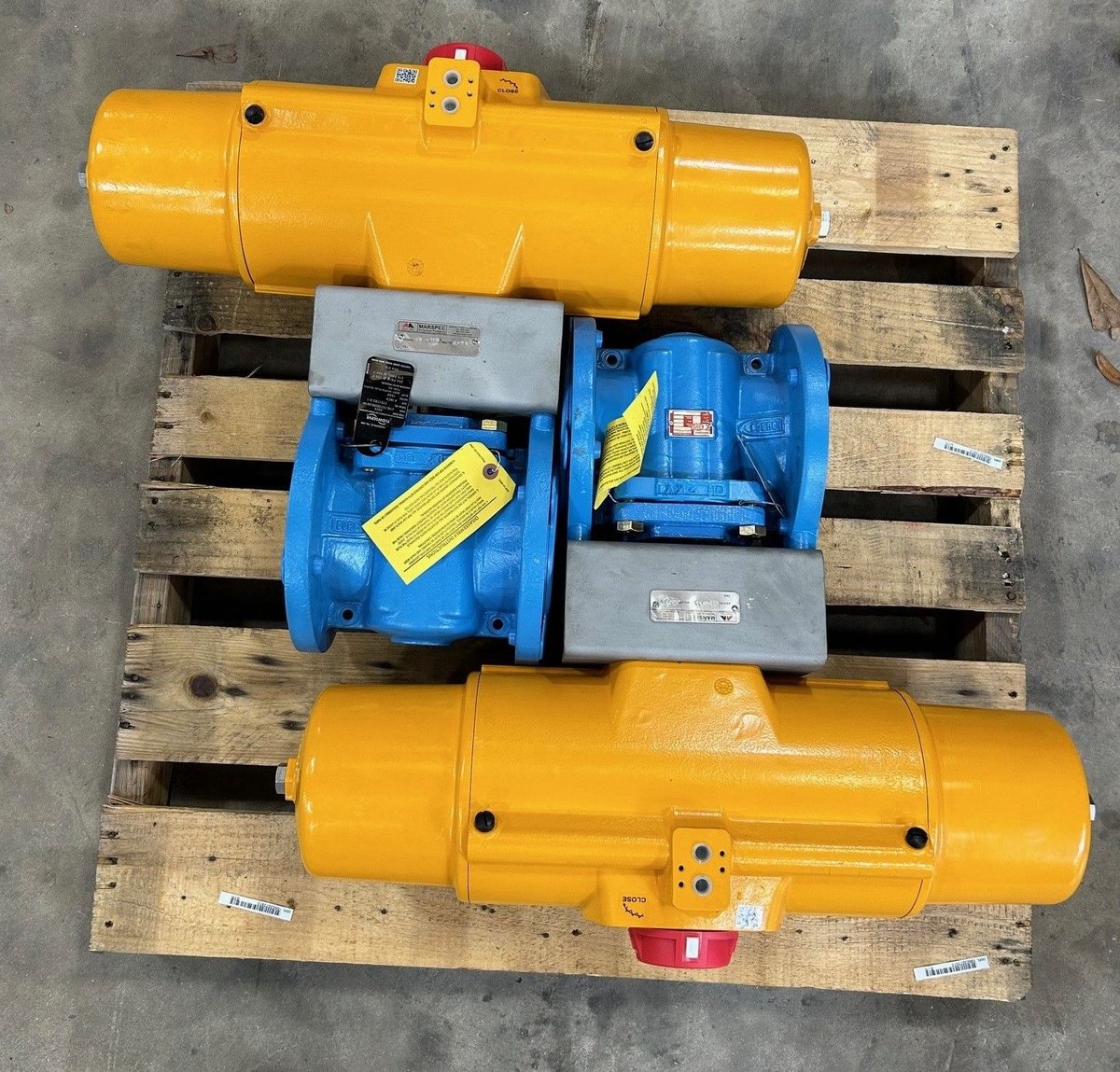Two actuated plug valves tagged and palletized for shipment
