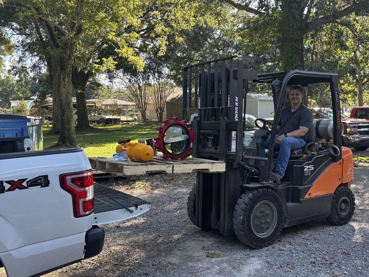 An automated lug butterfly valve on a pallet, loaded by forklift onto a customer's pickup